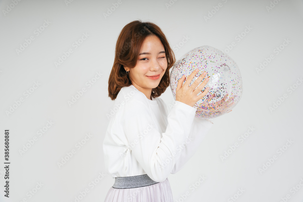 Young asian woman with glitter plastic ball isolate on white background. Young asian woman with glitter plastic ball isolate on white background.