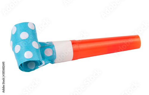 Photos Rolled festive noisemaker or party whistle horn on the white isolated