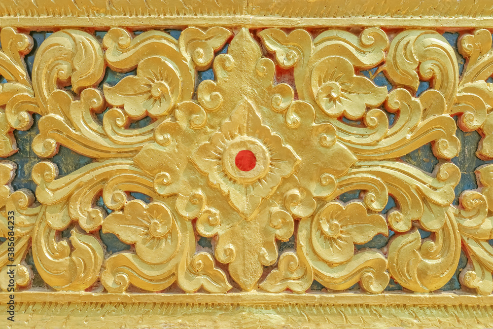 Background of cement gold decorative pattern,Traditional thai design in Thailand Temple wall