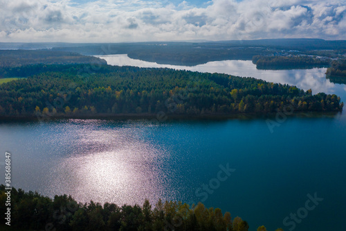 Drones panorama in the autumn lake landscape of the Upper Palatinate with turquoise blue water and sun reflections