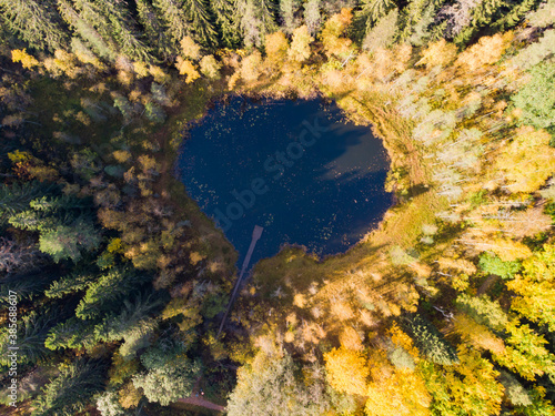 Aerial view of small forest lake Haransilma in Lahti, Finland. The diameter of lake is about 50 meters. photo