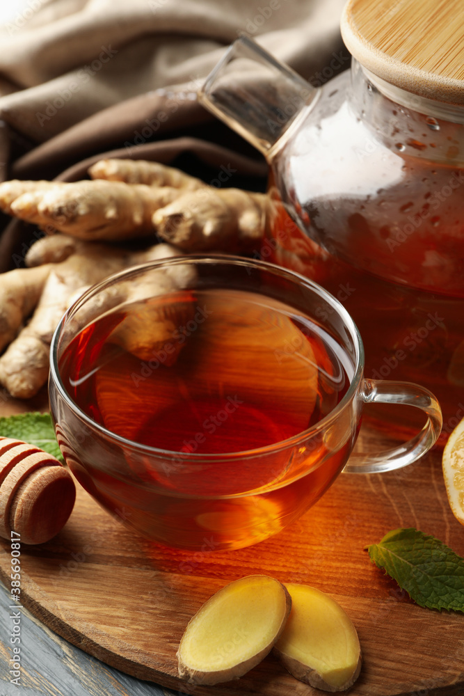 Concept of breakfast with ginger tea on wooden background Concept of breakfast with ginger tea on wooden background