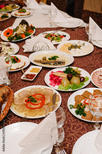 A table with cutlery, food, wine for people to celebrate. Concept of dining lunch. Business Lunch Concept. flat lay. top view.