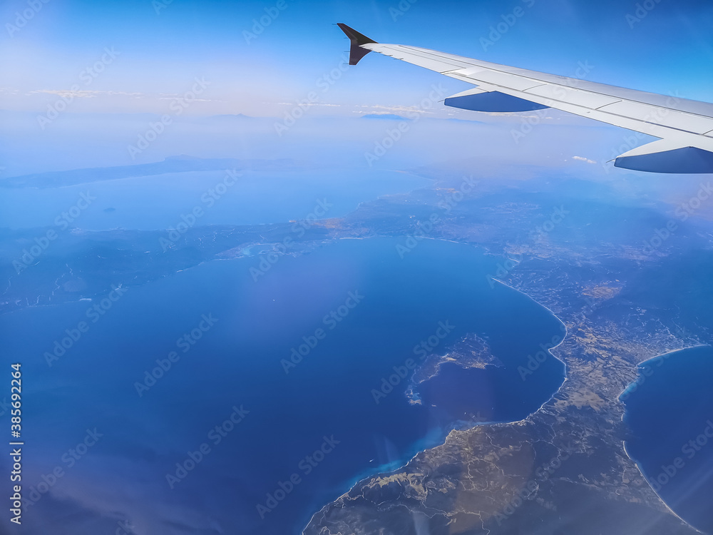 view to the coast and blue sea during a flight view to the coast and blue sea during a flight