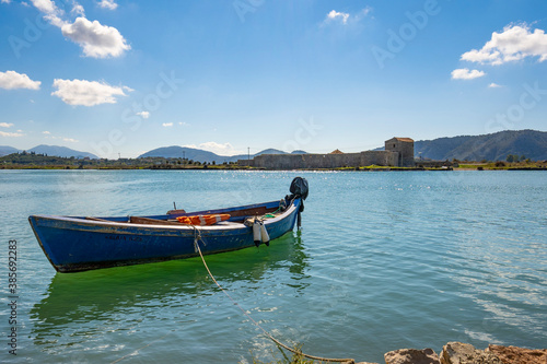 fishing boat on the lake with fortress © netdrimeny