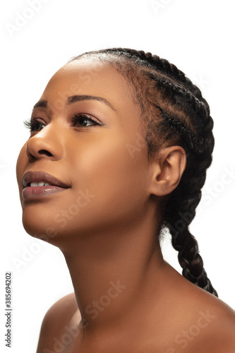 Shiny. Portrait of beautiful african-american woman isolated on white studio background. Beauty, fashion, skincare, cosmetics concept. Copyspace for ad. Well-kept skin and natural fresh look.