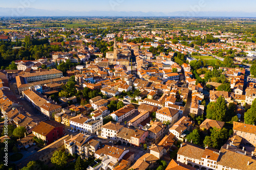 Scenic cityscape from drone of Italian town of Portogruaro in sunny day, Veneto, Italy