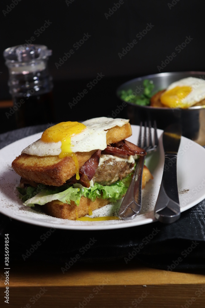 beef sandwich with runny egg