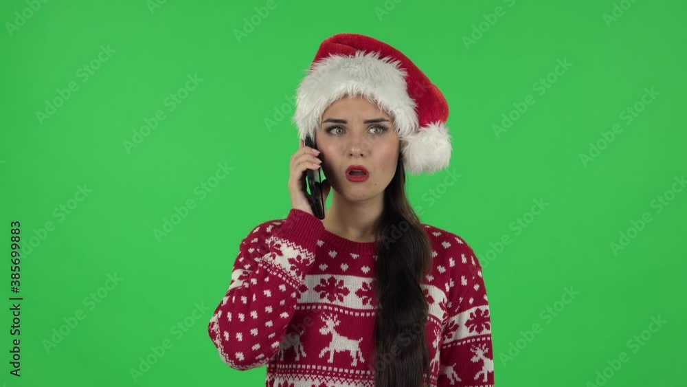 Portrait of sweety girl in Santa Claus hat very shocked then upset. Green screen Portrait of sweety girl in Santa Claus hat very shocked then upset. Green screen