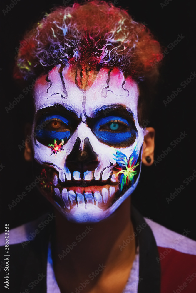 Young man with skull face