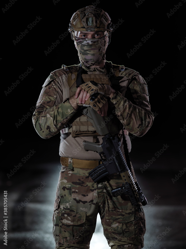 soldier with full combat gear in night mission soldier with full combat gear in night mission