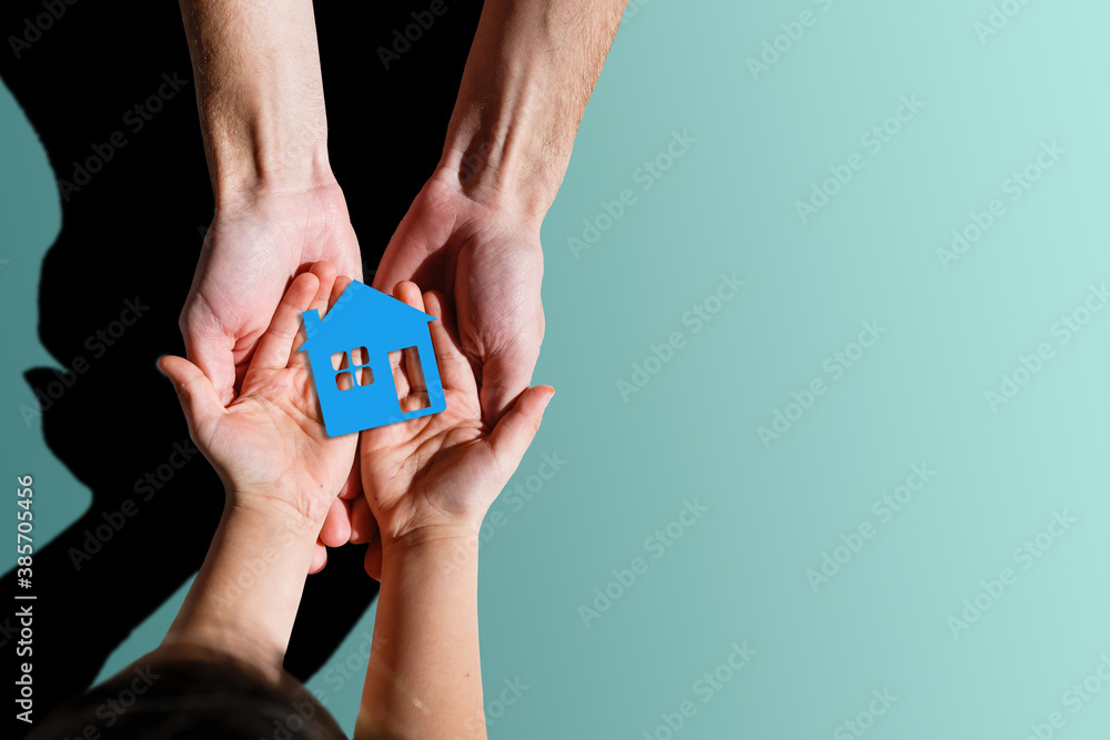 people, charity, family and home concept - close up of woman and girl holding paper house cutout in cupped hands people, charity, family and home concept - close up of woman and girl holding paper house cutout in cupped hands