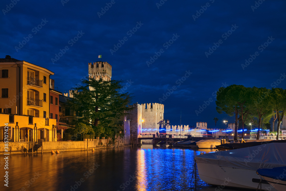 Scaligero Castle Sirmione Italy. Historic castle in Italy on Lake Garda at night.