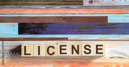 LICENSE word made up of building blocks on colored background