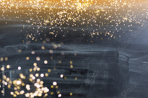 Golden bokeh lights with stone background desing