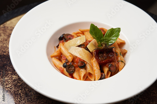 Pasta Penne with Tomato, olives and Basil