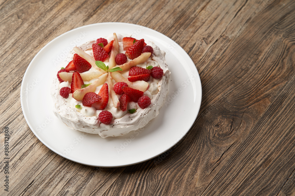 Strawberry cake with fresh strawberries on white plate Strawberry cake with fresh strawberries on white plate