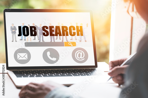 Billede på lærred New graduate using laptop look for online new job search from head hunters website ,Recruitment concept