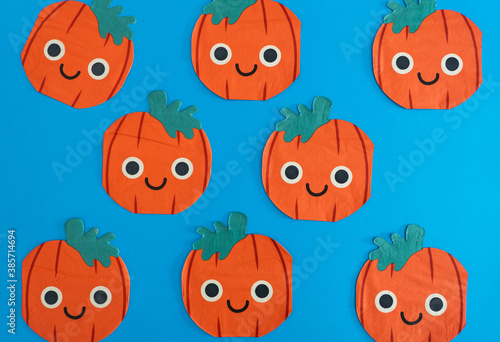 Lots of drawings of pumpkins with a blue background