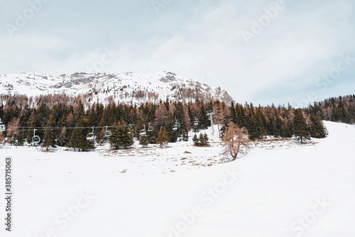 Winter landscape with mountain slopes covered with snow.