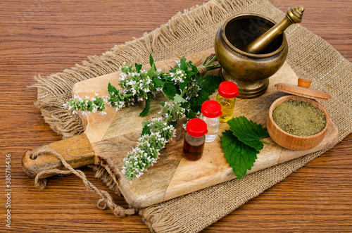 Fototapeta Naklejka Na Ścianę i Meble -  The use of herbs in folk medicine, bottles of tinctures.