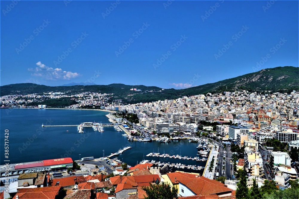 Kavala City and view from Ottoman Castle. Ancient Ottoman City in Greece: Kavala. Panoramic views of the aegean sea and vintage buildings. 