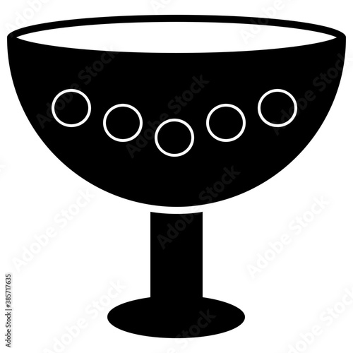 
A gold goblet with precious stones 
