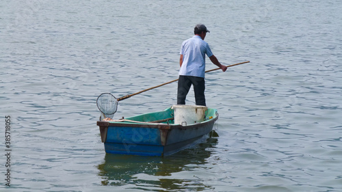 Chinese fisherman on a lake