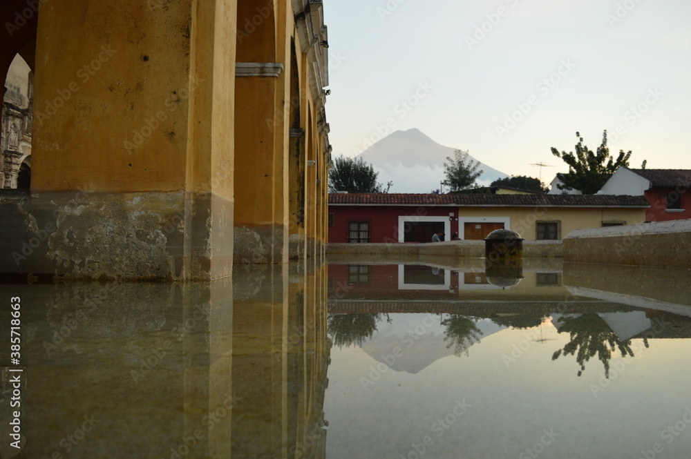 Obraz premium Sunrise over the stunning volcanoes and Lake Atitlan in Guatemala, Central America