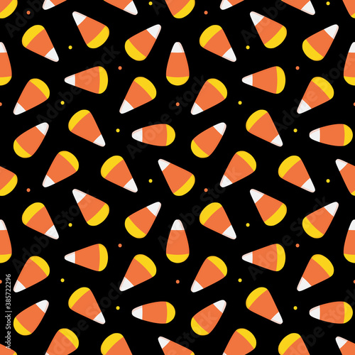 Candy corns and dots vector cartoon style seamless pattern background. Halloween trick or treat sweets background.