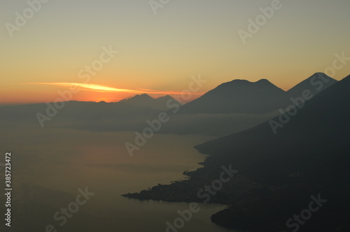 Sunrise over the volcanoes of Lake Atitlan in Guatemala, Central America