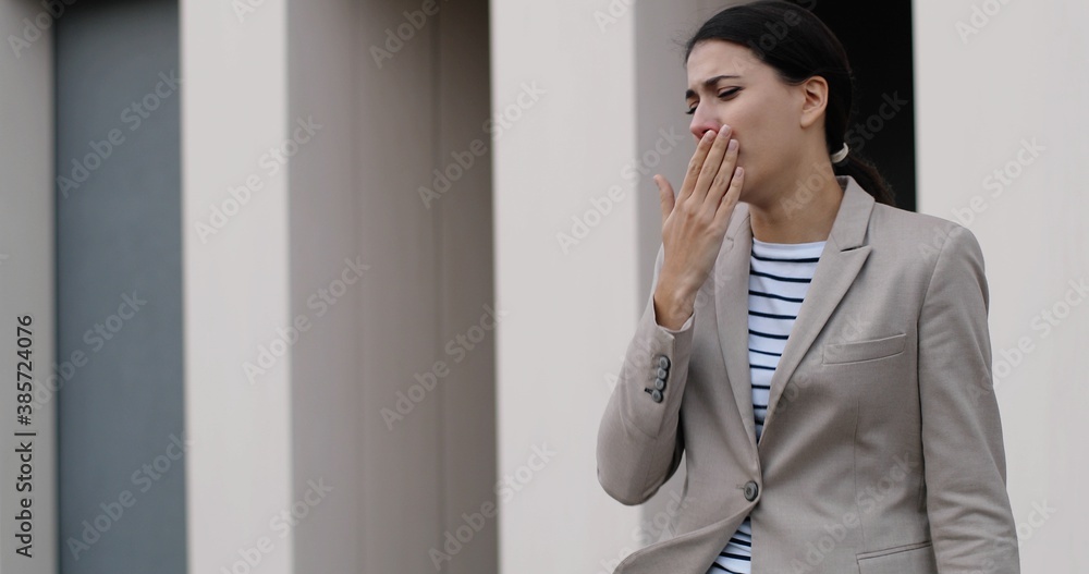Portrait of beautiful ill Caucasian woman in jacket walking in city and coughing. Sick unwell pretty young female worker outdoors having cold. Slow motion. Woman coughs and taking tissue Virus concept Portrait of beautiful ill Caucasian woman in jacket walking in city and coughing. Sick unwell pretty young female worker outdoors having cold. Slow motion. Woman coughs and taking tissue Virus concept