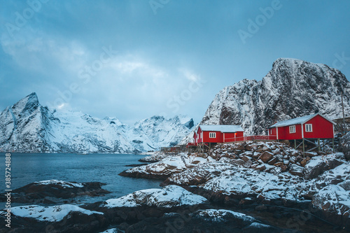 Famous Norwegian cabins covered by snow in Hamnøy in Lofoten.
