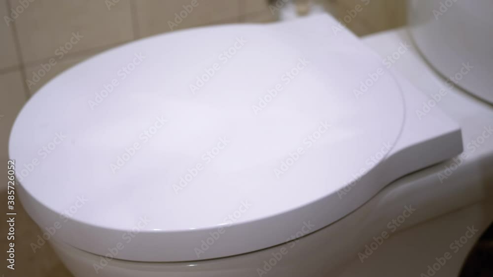 Lowering Toilet Bowl Lid. Automatic Close Toilet Lid. Toilet Smoothly Closes. Stock ビデオ Adobe