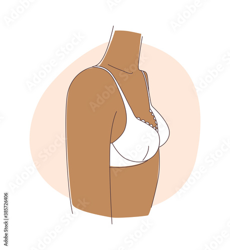 The puberty teenage girl and breast development. Wears pink bra.