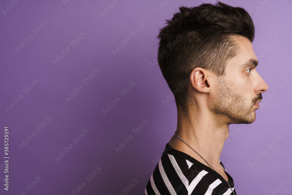 Photo in profile of happy man smiling and looking aside Photo in profile of happy man smiling and looking aside