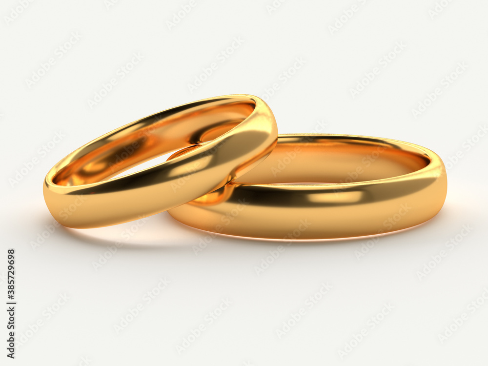 Wedding gold rings lie in each other isolated Wedding gold rings lie in each other isolated