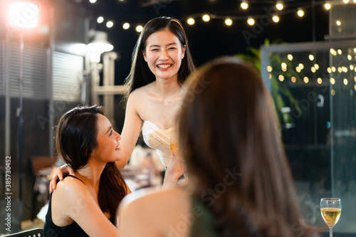 Group of cheerful young Asian people having a new year and Christmas celebrating.