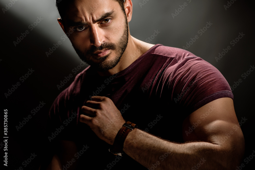 Brutal style portrait of handsome muscular young man