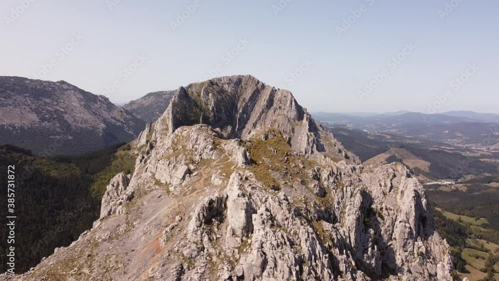 man on the top of a mountain, shot with drone man on the top of a mountain, shot with drone