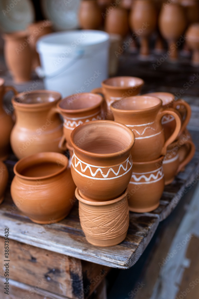 Earthenware on the table. Folk art. Earthenware on the table. Folk art.