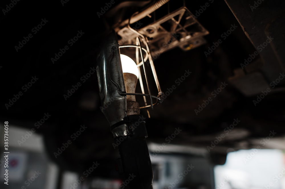 Car repair and maintenance theme. Light bulb in auto service. Car repair and maintenance theme. Light bulb in auto service.
