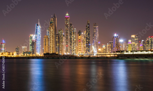 View of A Dubai Marina at night. Shot made from Palm Jumeirah, man made island. Dubai, UAE.