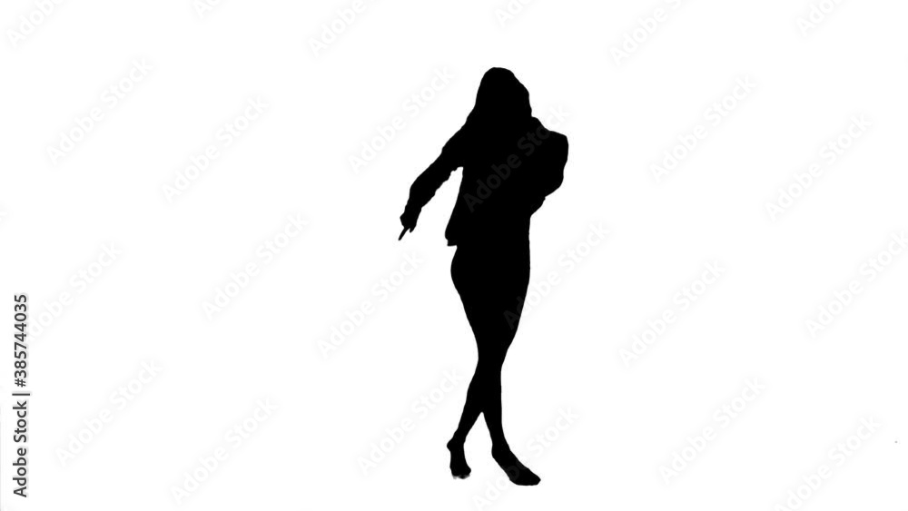 Silhouette. Professional dancer performs a choreographed dance over white background. Silhouette. Professional dancer performs a choreographed dance over white background.