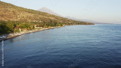 Wallpaper Mural Aerial footage with a tilt up motion of the wild coast in the Amed region in Bali with the Agung volcano in the background in Indonesia popular island Torontodigital.ca