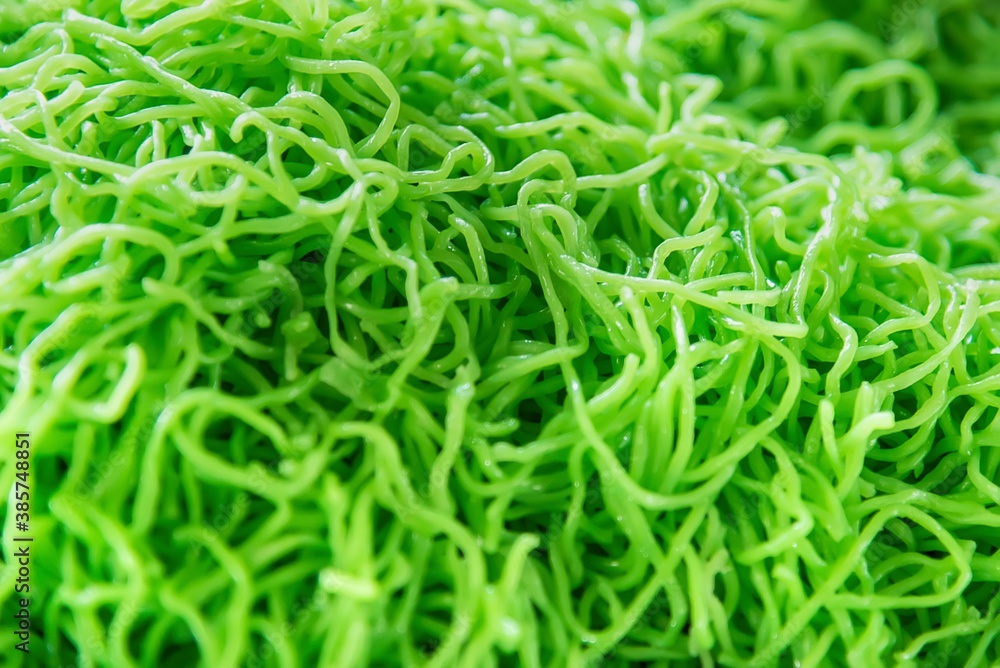 Green jade egg noodles or green noodle pattern background. Green jade egg noodles or green noodle pattern background.