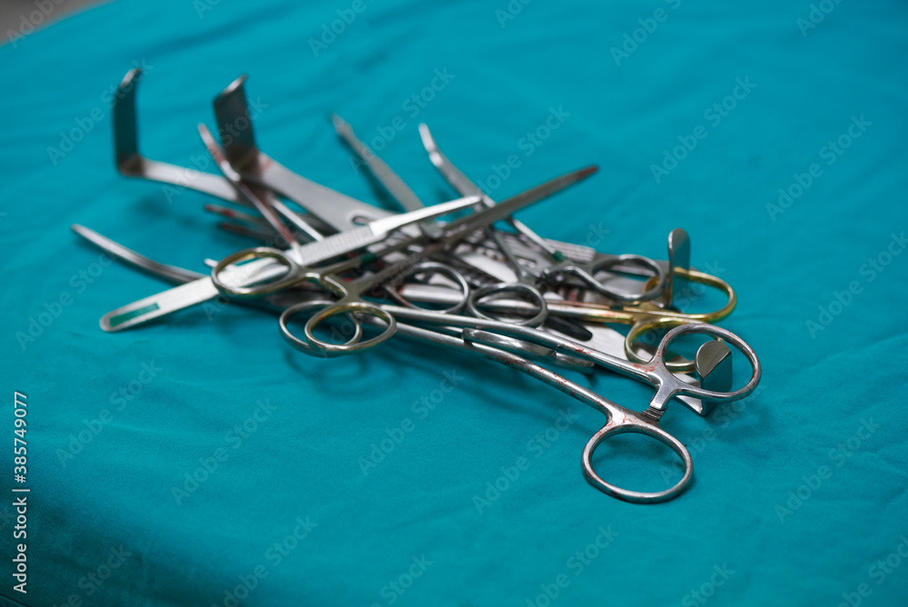 Surgical instruments after use on operating table Surgical instruments after use on operating table