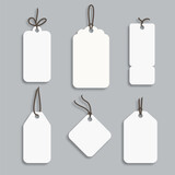 White paper price tag or gift tag in different shapes. Set of labels with cord.