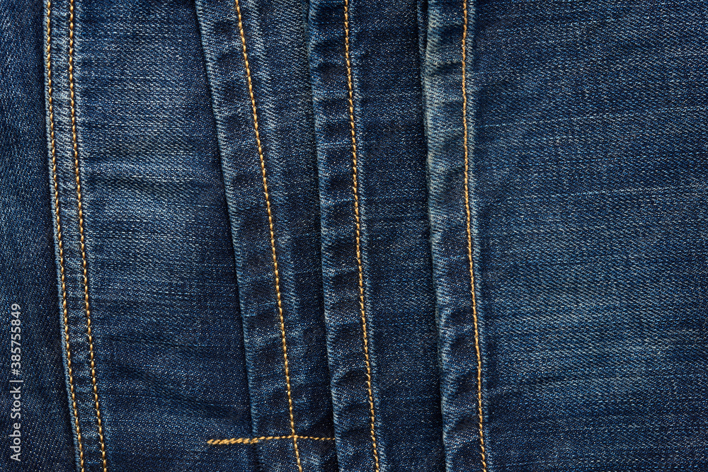 seam on blue jeans with brown thread, full frame seam on blue jeans with brown thread, full frame