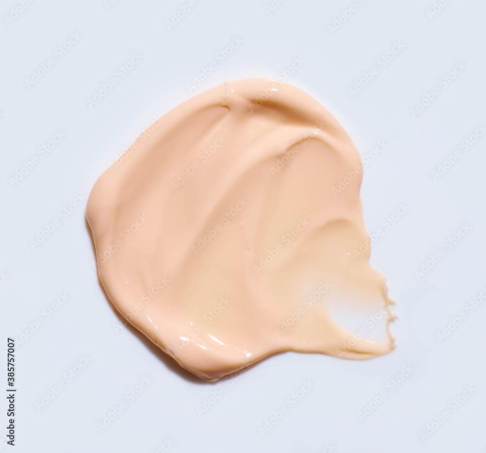 Swatch of beige facial cream on a grey background Swatch of beige facial cream on a grey background